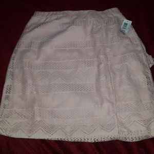 Really pretty. Side slit lace skirt never worn